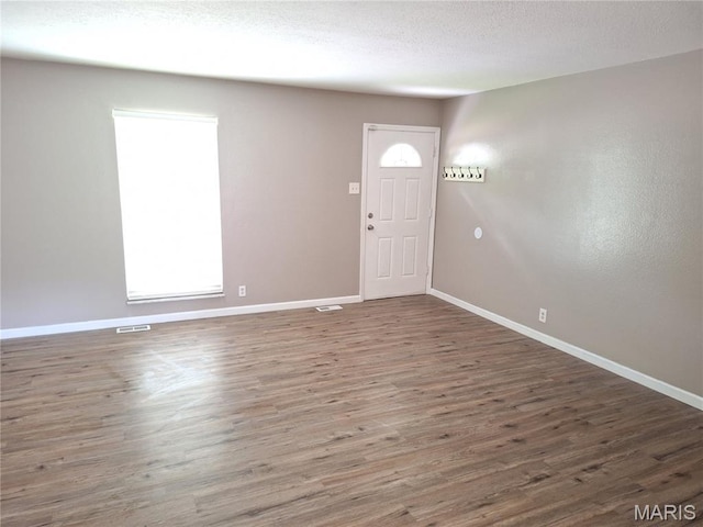 2465 Stoney End Ct, Florissant, MO 63031 - entryway featuring baseboards and wood finished floors