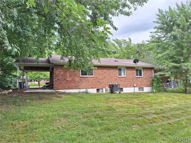 2465 Stoney End Ct, Florissant, MO 63031 - rear view of property featuring brick siding and a lawn