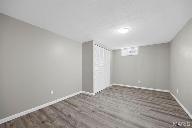4035 Mary Ridge Ln, Saint Charles, MO 63304 - unfurnished bedroom with wood finished floors and a textured ceiling