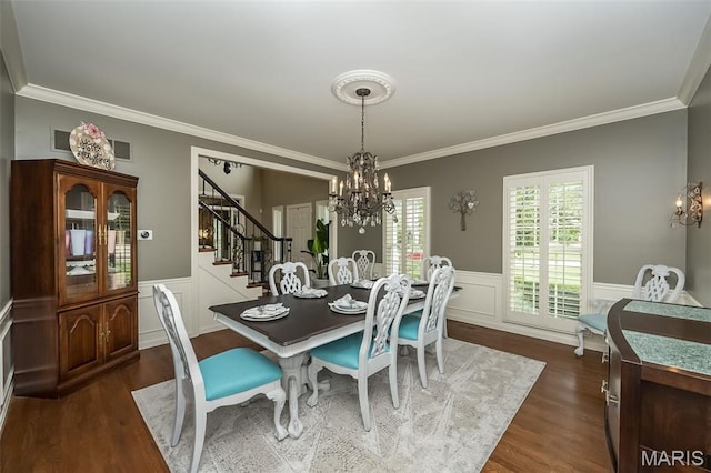 14703 Kulkarni Ct, Chesterfield, MO 63017 - dining space with a chandelier, stairs, crown molding, dark wood finished floors, and wainscoting