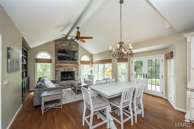 14703 Kulkarni Ct, Chesterfield, MO 63017 - dining area with a ceiling fan, dark wood-type flooring, a fireplace, a chandelier, and french doors