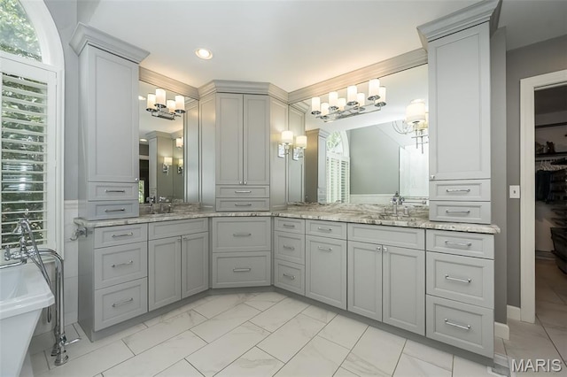 14703 Kulkarni Ct, Chesterfield, MO 63017 - bathroom featuring marble finish flooring, double vanity, a chandelier, plenty of natural light, and recessed lighting