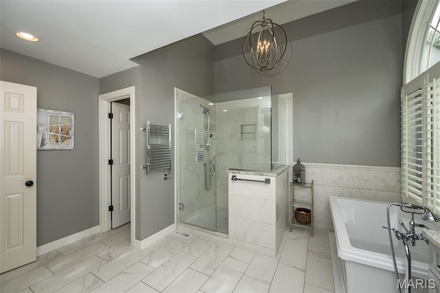 14703 Kulkarni Ct, Chesterfield, MO 63017 - bathroom featuring a soaking tub, a stall shower, marble look tile flooring, a chandelier, and recessed lighting