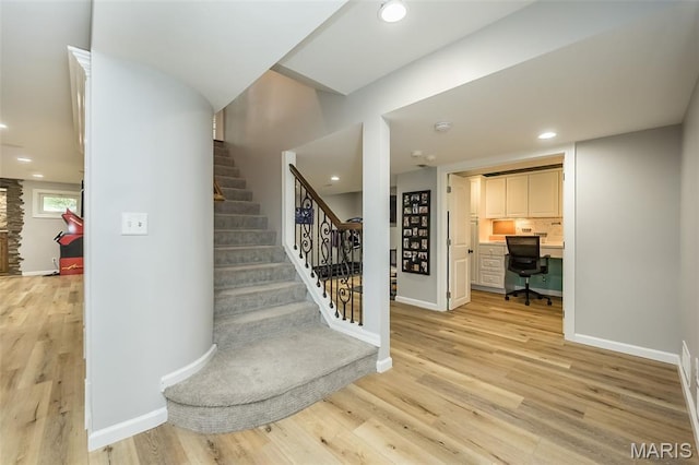 14703 Kulkarni Ct, Chesterfield, MO 63017 - stairway with wood finished floors, recessed lighting, and built in study area