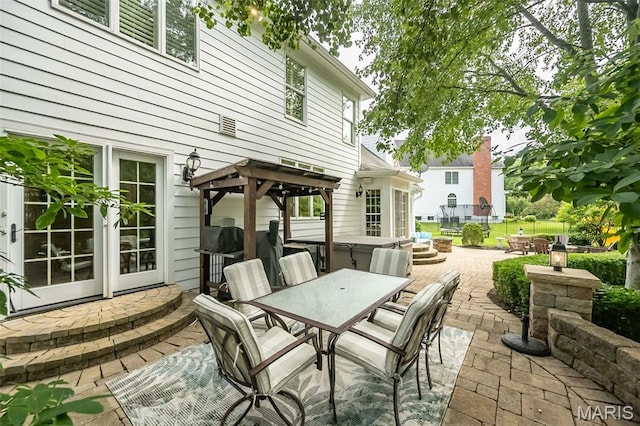 14703 Kulkarni Ct, Chesterfield, MO 63017 - view of patio / terrace with outdoor dining area and a covered hot tub