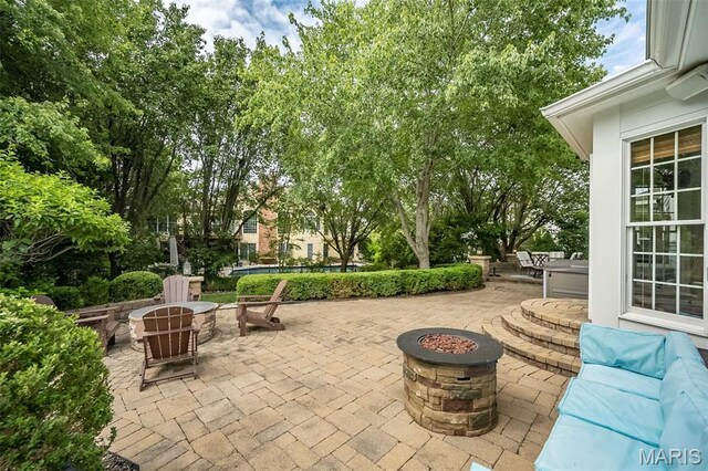 14703 Kulkarni Ct, Chesterfield, MO 63017 - view of patio / terrace with a fire pit