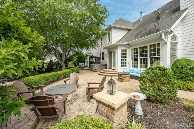 14703 Kulkarni Ct, Chesterfield, MO 63017 - view of patio with a hot tub and a fire pit