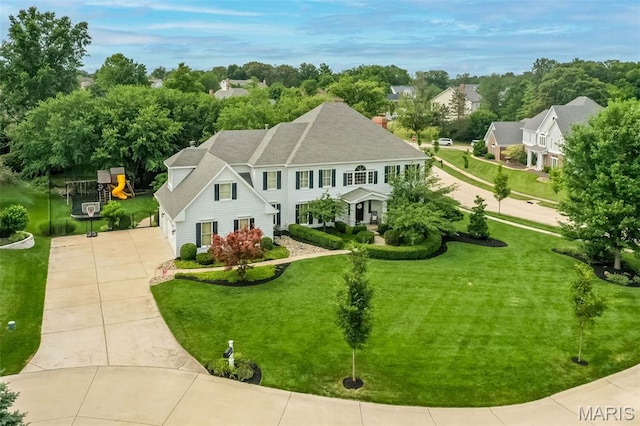 14703 Kulkarni Ct, Chesterfield, MO 63017 - view of front of home with driveway, a front yard, a garage, and a chimney