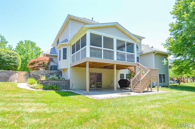 15 Fox Mill Dr, Maryville, IL 62062 - back of house with stairway, a patio area, a sunroom, and a lawn
