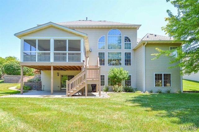 15 Fox Mill Dr, Maryville, IL 62062 - rear view of house featuring a patio, a sunroom, a lawn, and stairs