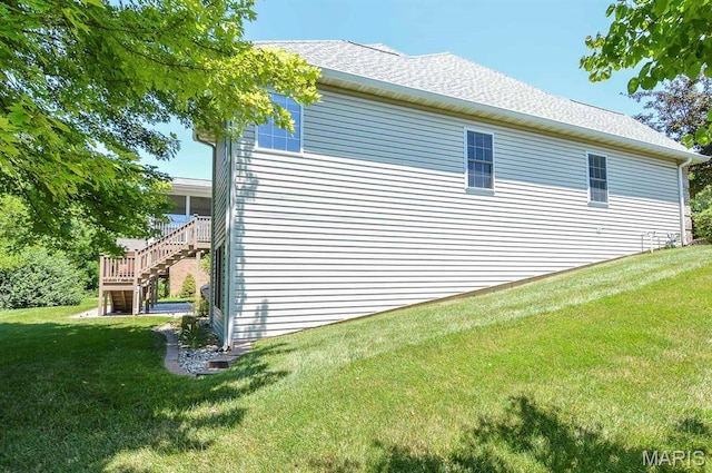 15 Fox Mill Dr, Maryville, IL 62062 - view of home's exterior with stairway, a lawn, and roof with shingles