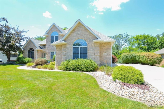 15 Fox Mill Dr, Maryville, IL 62062 - view of front facade with a front yard and brick siding