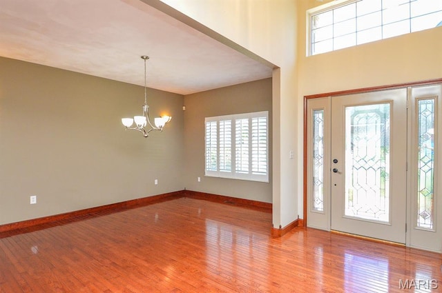 15 Fox Mill Dr, Maryville, IL 62062 - entrance foyer featuring a chandelier, plenty of natural light, and wood finished floors