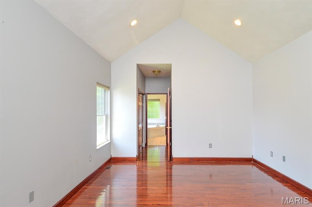 15 Fox Mill Dr, Maryville, IL 62062 - spare room with wood finished floors, high vaulted ceiling, and recessed lighting
