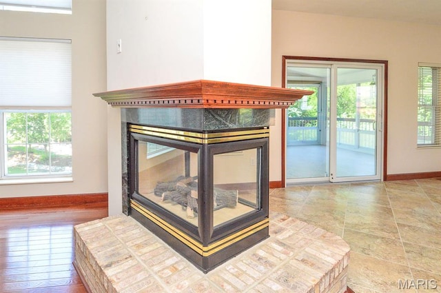 15 Fox Mill Dr, Maryville, IL 62062 - detailed view of a multi sided fireplace and baseboards