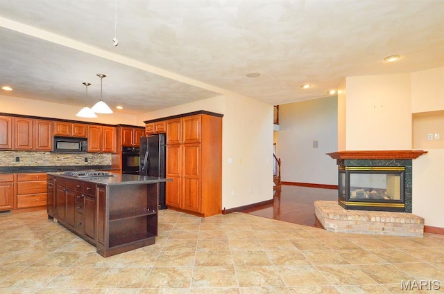 15 Fox Mill Dr, Maryville, IL 62062 - kitchen featuring black appliances, dark countertops, recessed lighting, a kitchen island, and backsplash