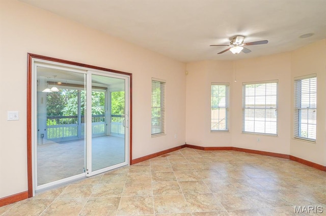 15 Fox Mill Dr, Maryville, IL 62062 - empty room with a ceiling fan and baseboards