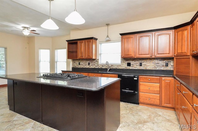 15 Fox Mill Dr, Maryville, IL 62062 - kitchen with dishwasher, decorative backsplash, stainless steel gas cooktop, a ceiling fan, and a kitchen island