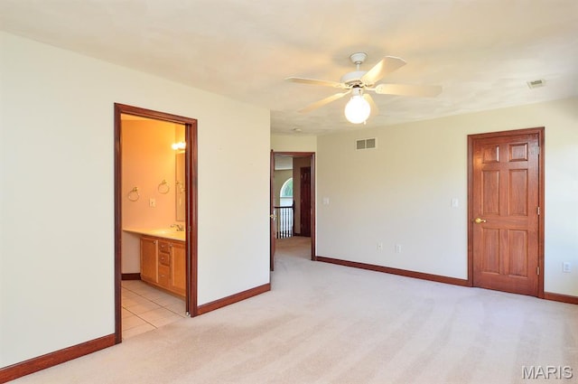15 Fox Mill Dr, Maryville, IL 62062 - spare room featuring ceiling fan and light carpet