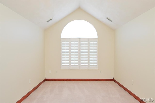 15 Fox Mill Dr, Maryville, IL 62062 - carpeted empty room with vaulted ceiling and baseboards