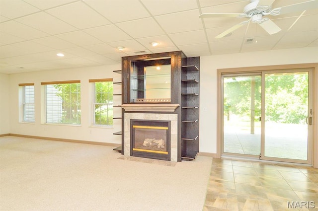 15 Fox Mill Dr, Maryville, IL 62062 - unfurnished living room featuring a tiled fireplace, recessed lighting, and ceiling fan