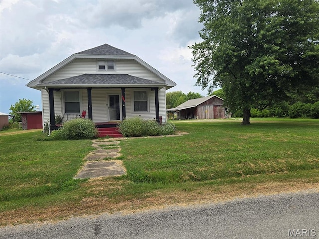 161 W Locust St, Hoyleton, IL 62803 - bungalow-style house with a porch, a shingled roof, and a front lawn