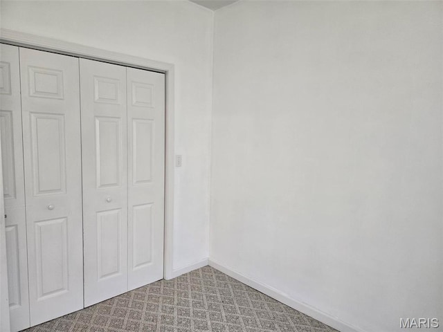 161 W Locust St, Hoyleton, IL 62803 - unfurnished bedroom with a closet and baseboards