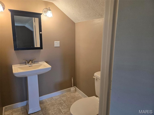161 W Locust St, Hoyleton, IL 62803 - half bathroom featuring lofted ceiling and a textured ceiling