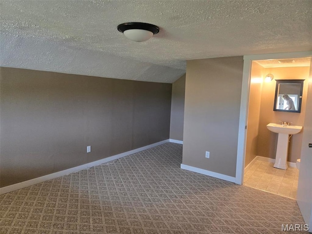 161 W Locust St, Hoyleton, IL 62803 - unfurnished bedroom with a textured ceiling, carpet, and ensuite bath