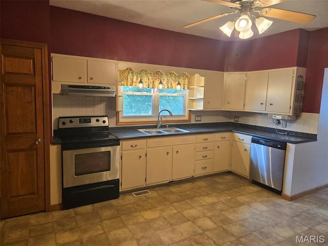 161 W Locust St, Hoyleton, IL 62803 - kitchen with stainless steel appliances, dark countertops, decorative backsplash, ceiling fan, and stone finish flooring