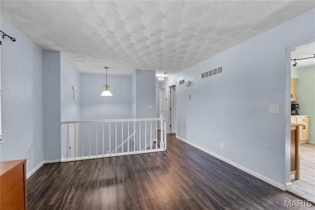 206 Saint Jude, Saint Genevieve, MO 63670 - spare room featuring wood finished floors and a textured ceiling