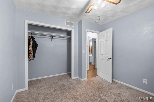 206 Saint Jude, Saint Genevieve, MO 63670 - unfurnished bedroom featuring carpet flooring, a closet, and ceiling fan