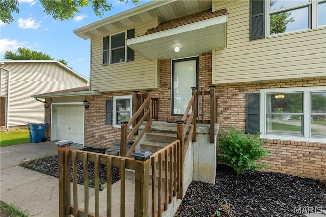 206 Saint Jude, Saint Genevieve, MO 63670 - entrance to property with brick siding, an attached garage, and driveway