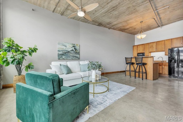 2323 Locust St Unit 405, Saint Louis, MO 63103 - living area featuring finished concrete flooring and a ceiling fan