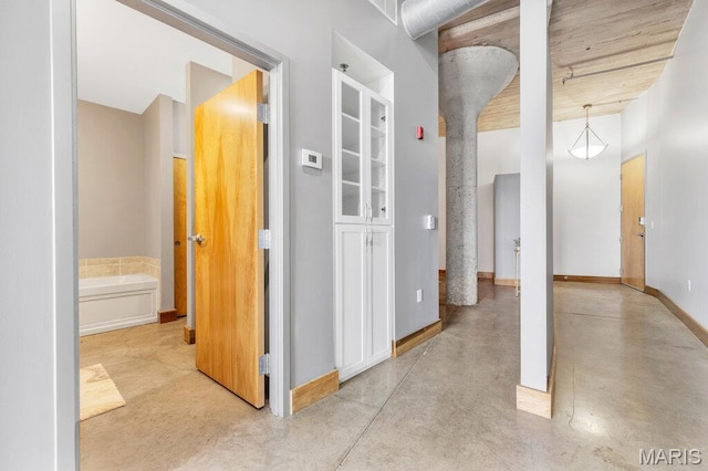 2323 Locust St Unit 405, Saint Louis, MO 63103 - corridor with finished concrete flooring and baseboards