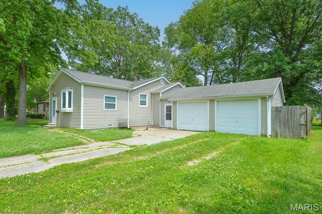 314 N 6th St, Mascoutah, IL 62258 - back of house featuring driveway and a garage