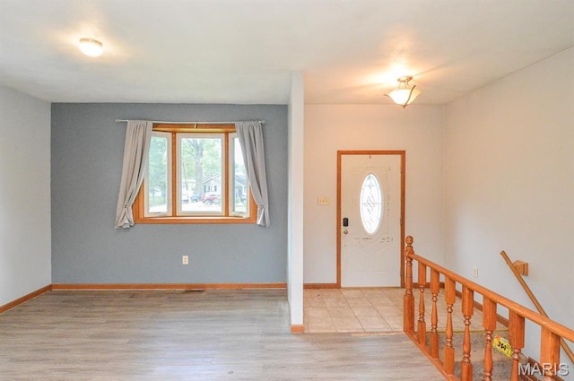 314 N 6th St, Mascoutah, IL 62258 - entrance foyer with healthy amount of natural light and wood finished floors