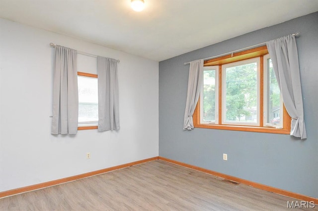 314 N 6th St, Mascoutah, IL 62258 - unfurnished room featuring wood finished floors and baseboards