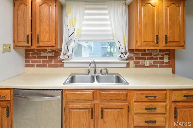 314 N 6th St, Mascoutah, IL 62258 - kitchen featuring dishwasher, light countertops, and brown cabinetry