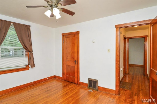314 N 6th St, Mascoutah, IL 62258 - empty room featuring wood finished floors and ceiling fan
