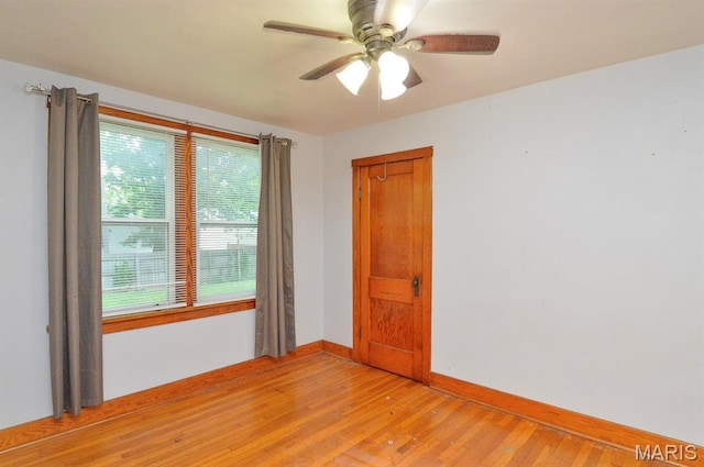 314 N 6th St, Mascoutah, IL 62258 - empty room with light wood-style floors and ceiling fan