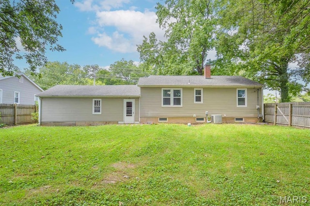 314 N 6th St, Mascoutah, IL 62258 - rear view of property with a chimney and a fenced backyard