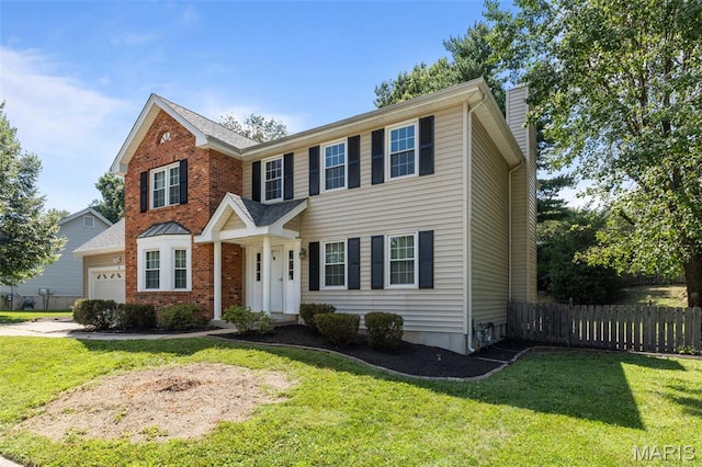 17 Beaujolais Dr, Florissant, MO 63031 - view of front facade featuring a chimney, an attached garage, and brick siding