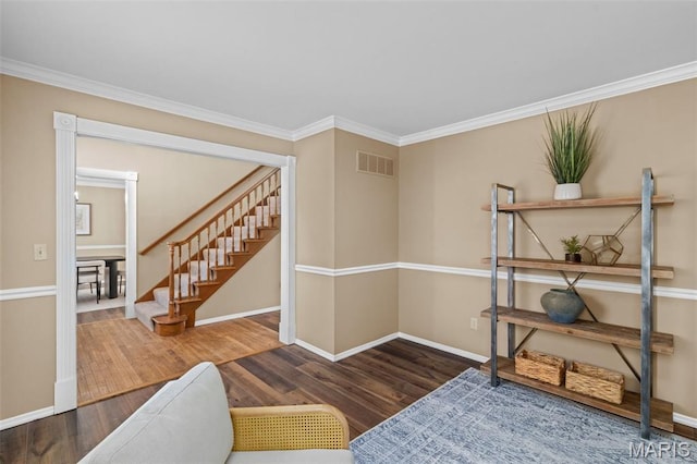 17 Beaujolais Dr, Florissant, MO 63031 - sitting room with wood finished floors, stairs, and crown molding