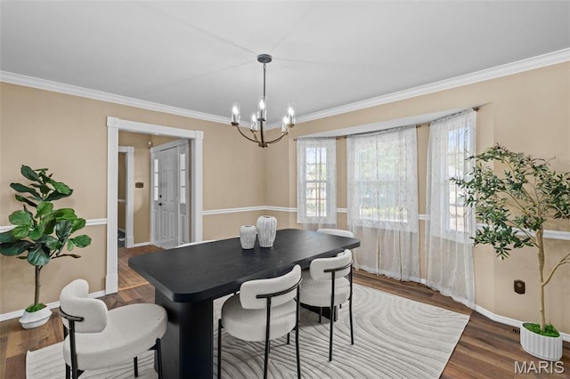 17 Beaujolais Dr, Florissant, MO 63031 - dining area featuring a chandelier, wood finished floors, and ornamental molding