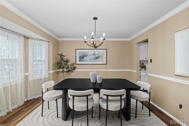 17 Beaujolais Dr, Florissant, MO 63031 - dining space featuring ornamental molding, wood finished floors, and a chandelier