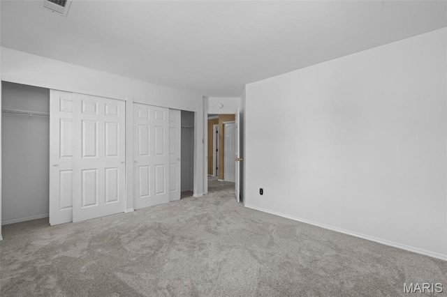 17 Beaujolais Dr, Florissant, MO 63031 - unfurnished bedroom featuring multiple closets and carpet floors