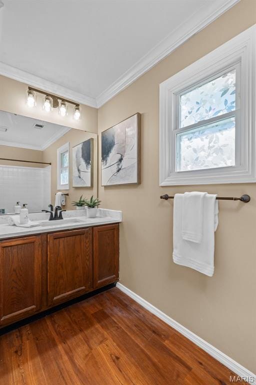 17 Beaujolais Dr, Florissant, MO 63031 - full bath with double vanity, wood finished floors, and ornamental molding