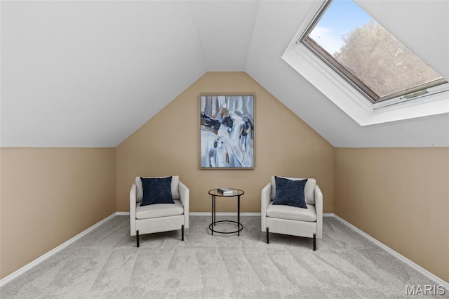 17 Beaujolais Dr, Florissant, MO 63031 - living area with carpet floors, vaulted ceiling, and a skylight