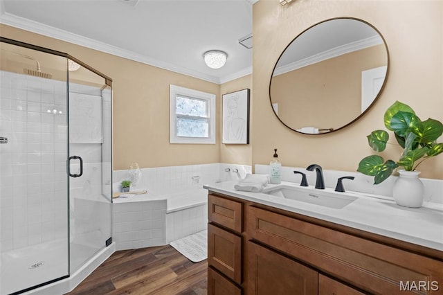 17 Beaujolais Dr, Florissant, MO 63031 - full bathroom featuring vanity, a stall shower, a garden tub, wood finished floors, and crown molding